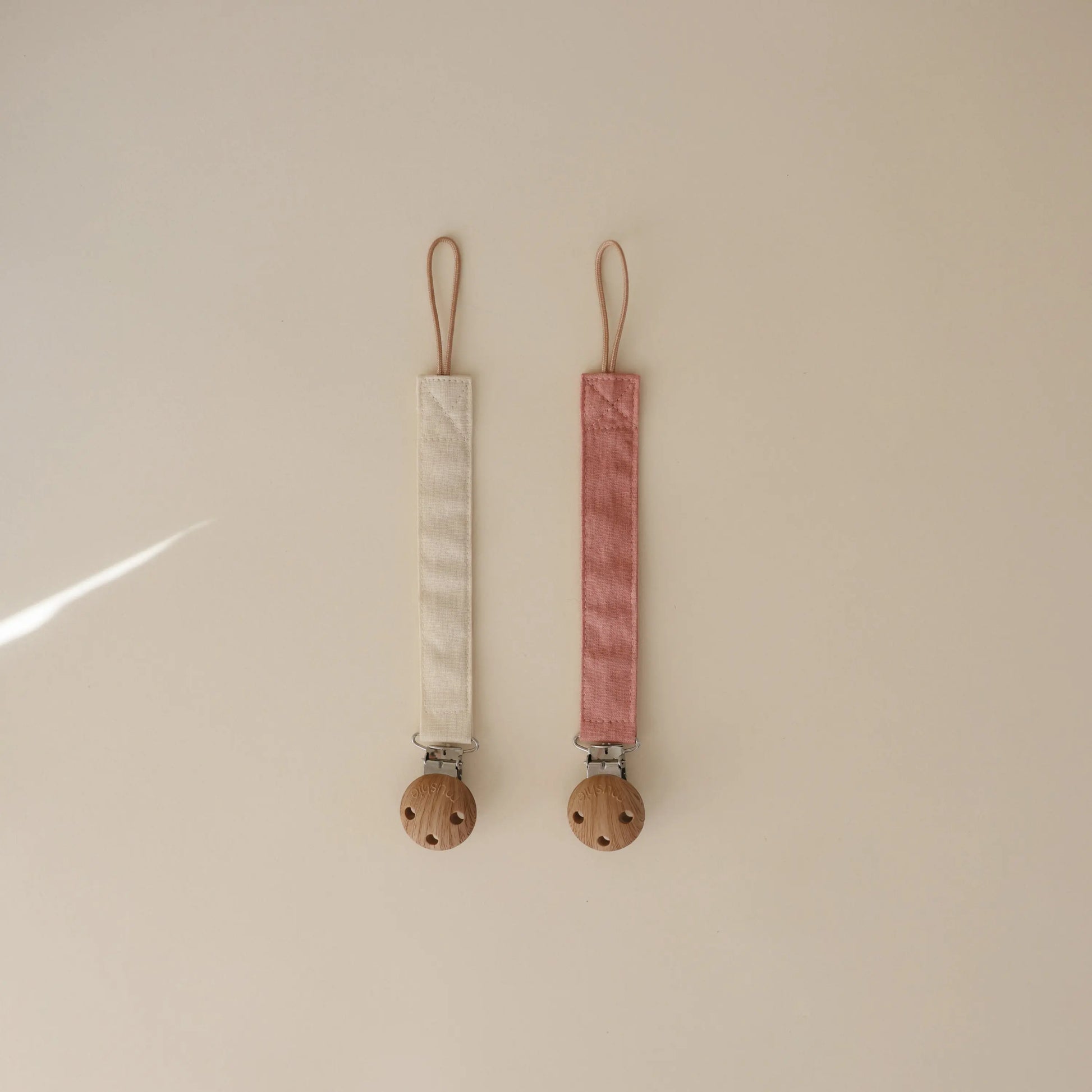 Linen Pacifier Clip Two Pack with Water Resistant Coating and Faux Wood Silicone Clasp Mushie