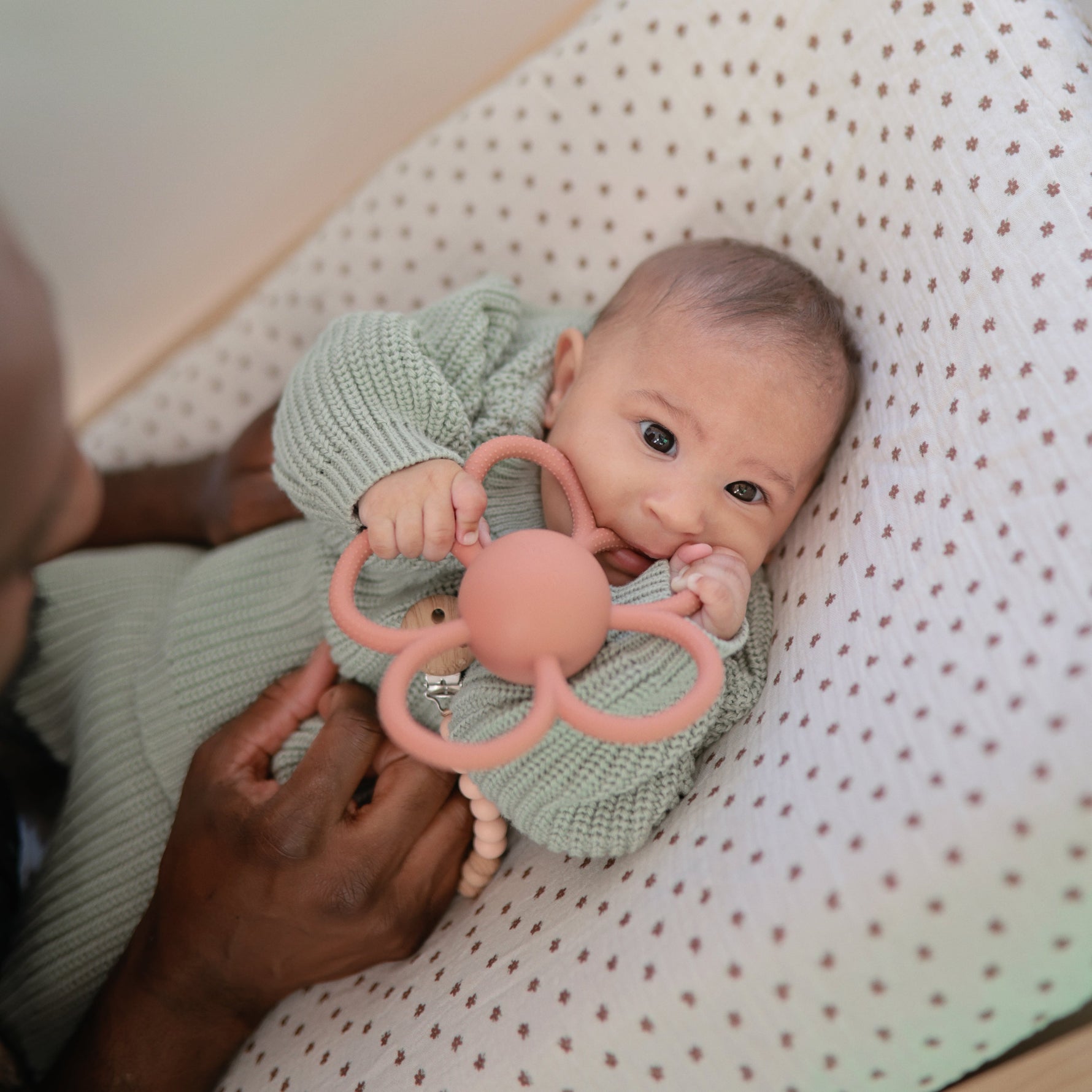 Mushie Daisy Rattle Teether, white flower shape, baby sensory and teething toy.