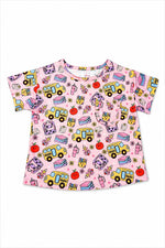 Short-sleeve girls tee with a boxy fit, ruffle trim, and a front pocket.