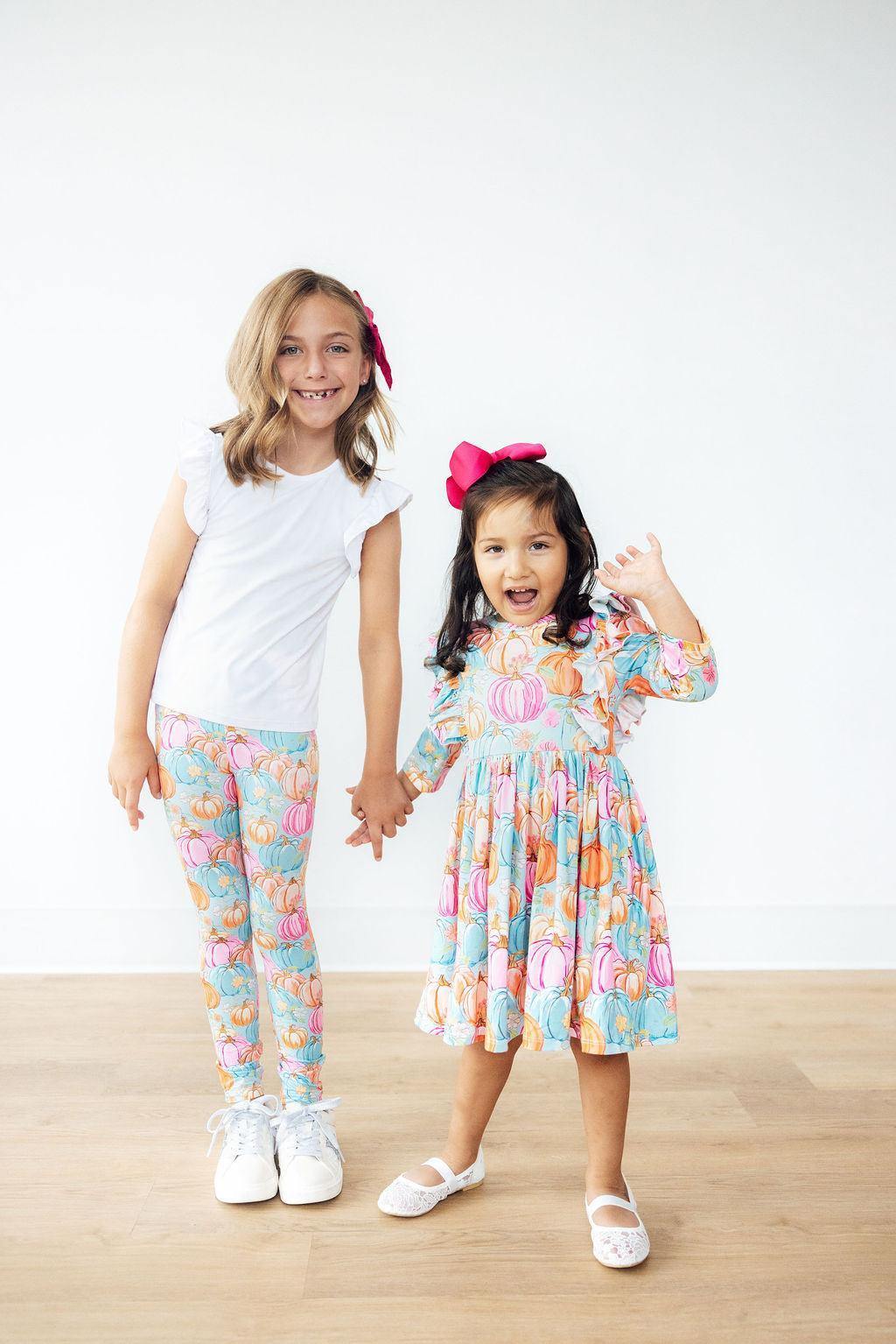 Mila & Rose Preppy Pumpkins soft baby leggings, orange pumpkin print.