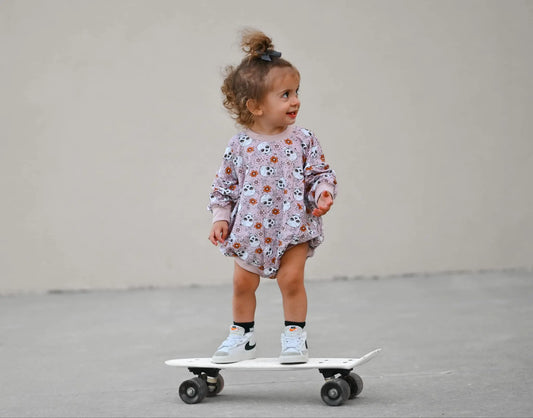 Purple Floral Skulls Bamboo Bubble Romper Little Joy Co. Everetts Place: Online Boutique
