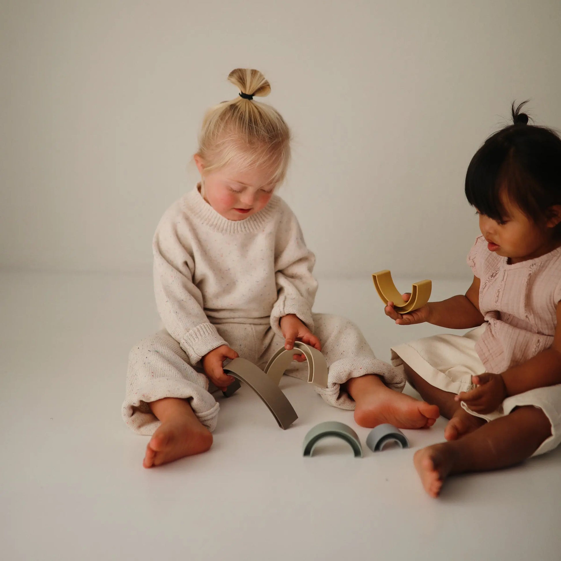 Rainbow Stacker Toy from Danish Hygge Collection for Learning and Play Mushie Everetts Place: Online Boutique