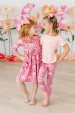 Mila & Rose Rainbow Wishes organic baby leggings with colorful stripes.