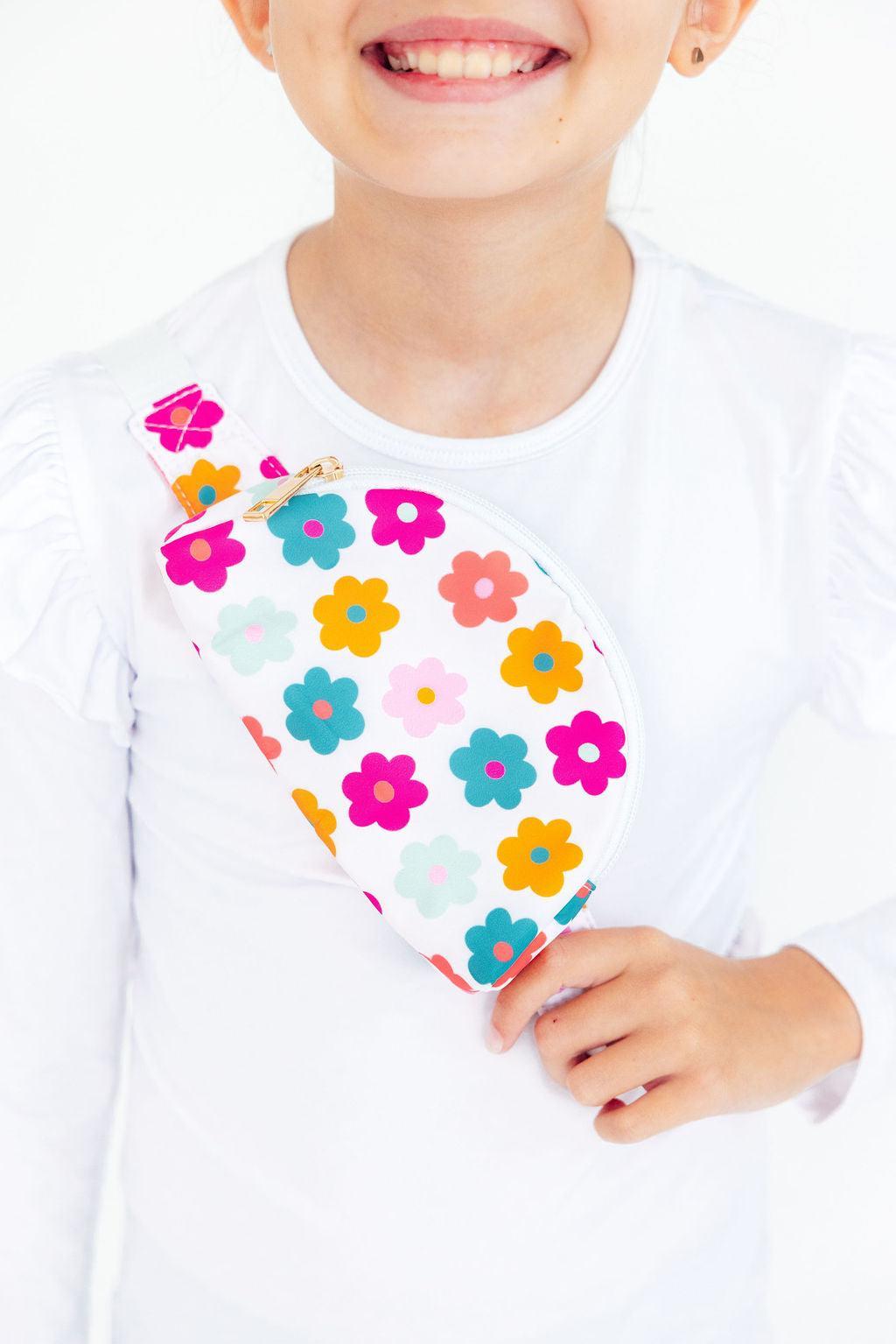 Kids belt bag in retro floral print with adjustable strap and zip pouch