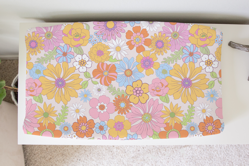 Retro floral changing pad cover made of soft, stretchy fabric, fits most pads 32x16 inches.