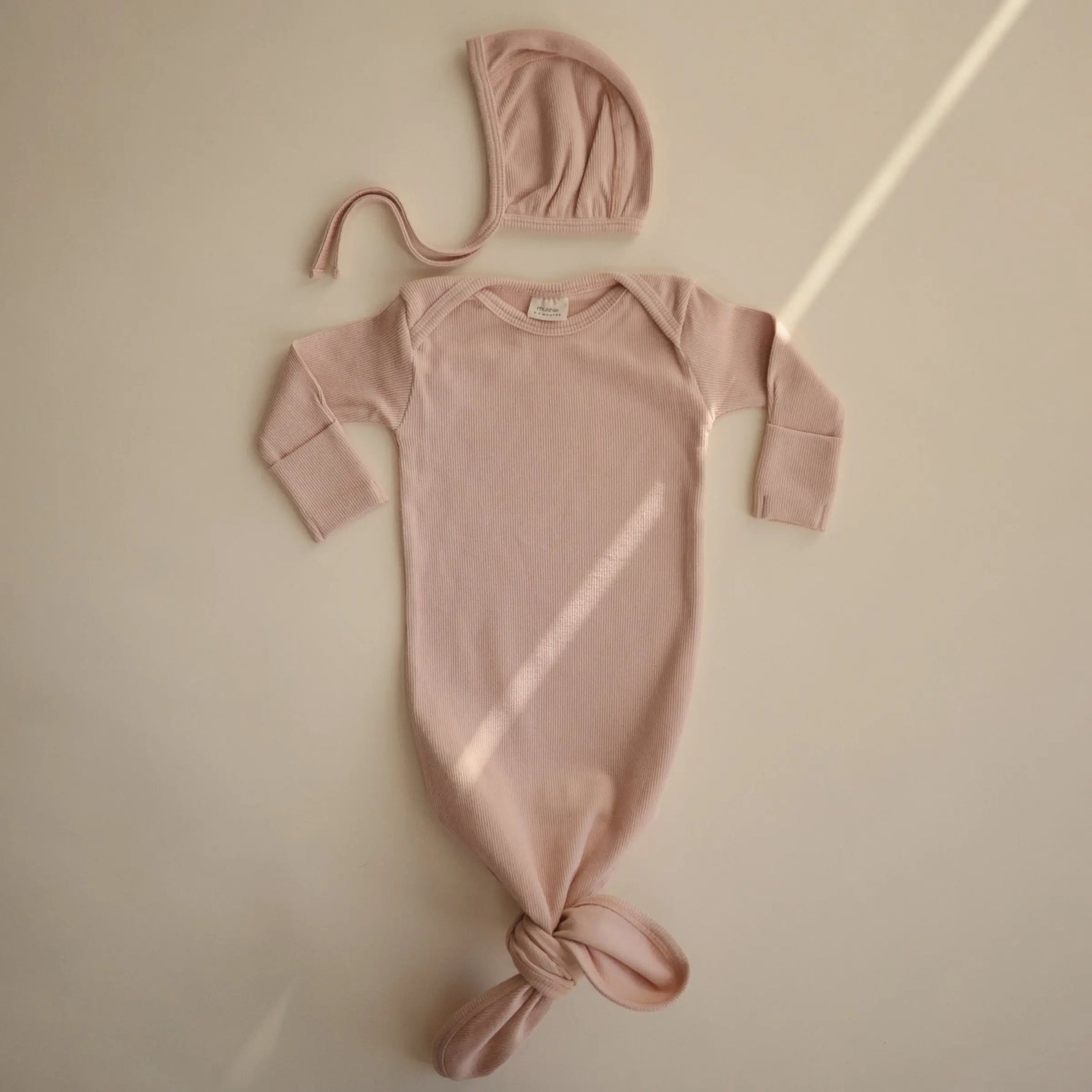 Mushie Ribbed Baby Bonnet Made with Organic Cotton for Warmth and Comfort - Apparel & Accessories > Clothing > Baby & Toddler Clothing > Baby One-Pieces Baby Clothes