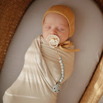 Mushie Ribbed Baby Bonnet Made with Organic Cotton for Warmth and Comfort - Apparel & Accessories > Clothing > Baby & Toddler Clothing > Baby One-Pieces Baby Clothes