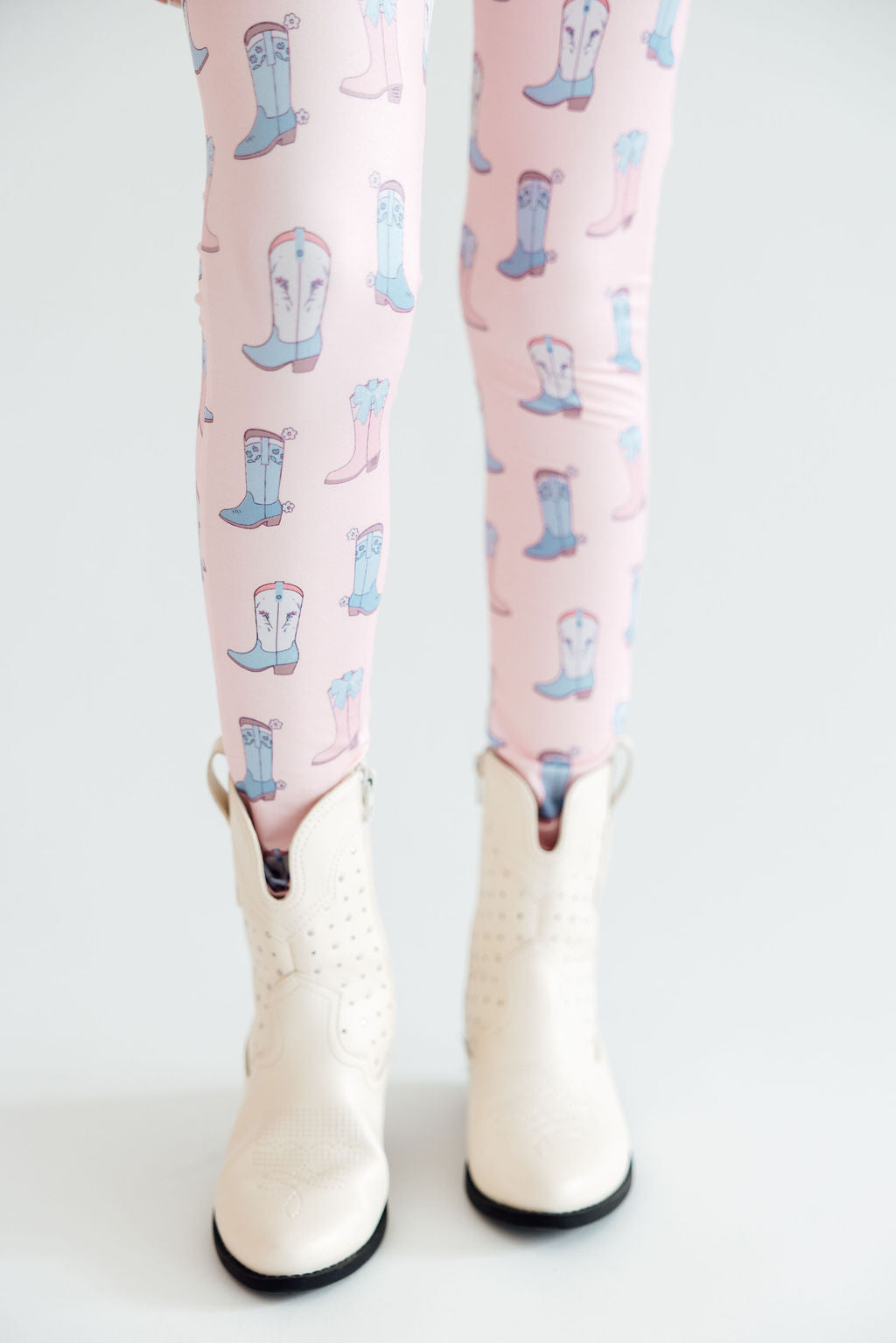 Mila & Rose Ribbons & Rodeos baby leggings. Western print with bows and boots.