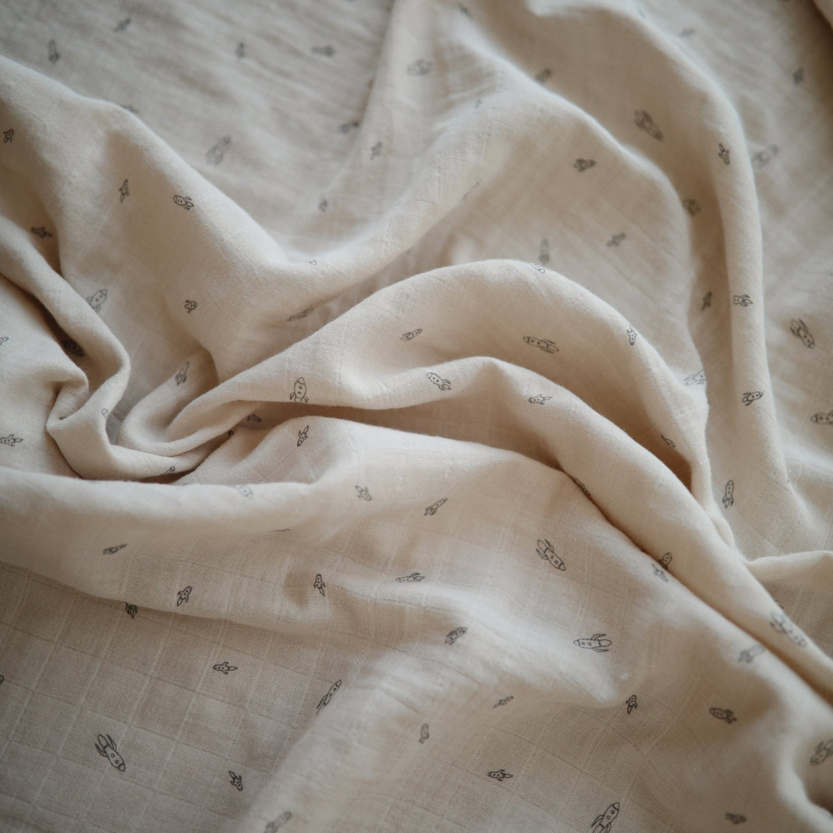 Mushie organic cotton muslin swaddle blanket, soft, breathable, natural.