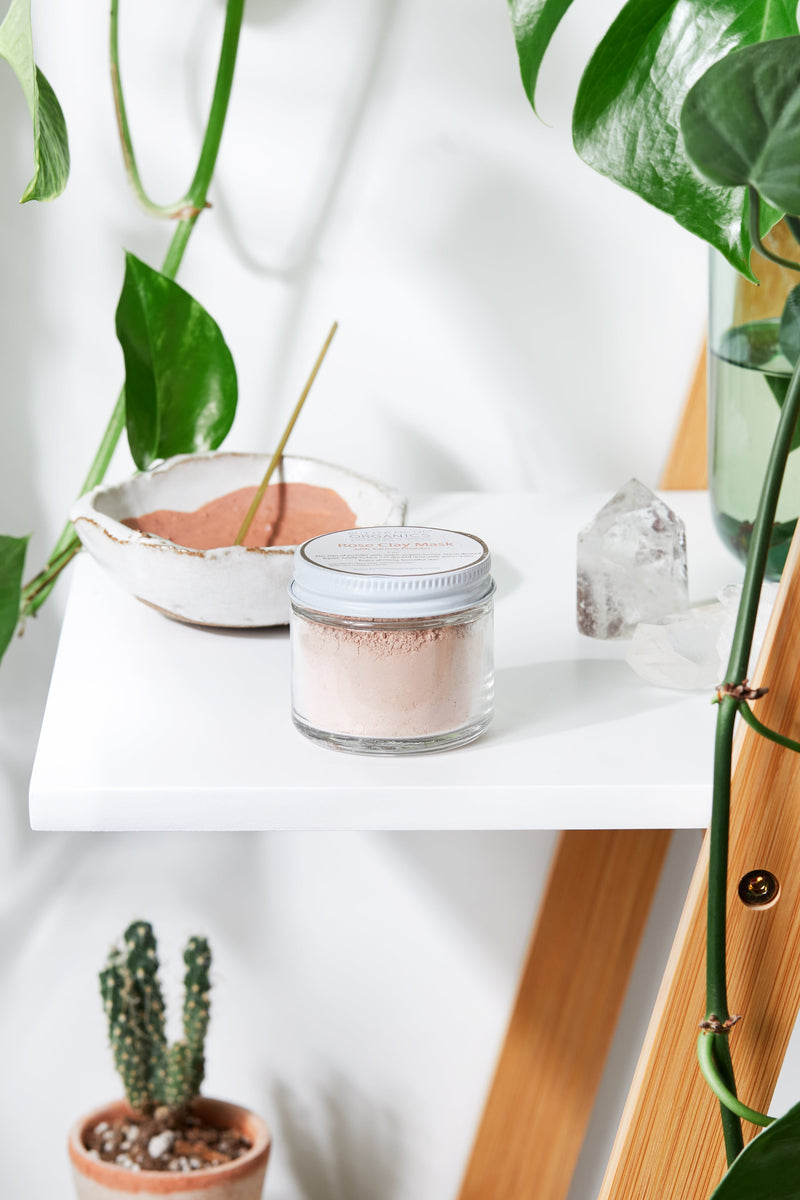 Rose Clay Face Mask in glass jar on a shelf with natural decor.