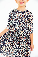 Girls' 3/4 sleeve twirl dress in the Wild One print with a full skirt and side pockets.
