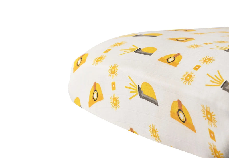 Bamboo muslin crib sheet with hard hat pattern, breathable and soft, fits standard crib mattresses.