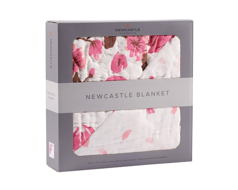 Cherry Blossom Bamboo Muslin Newcastle Blanket in packaging, featuring a pink floral design on breathable natural bamboo fibers.