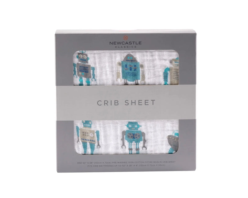 Robot-patterned cotton muslin crib sheet in packaging.