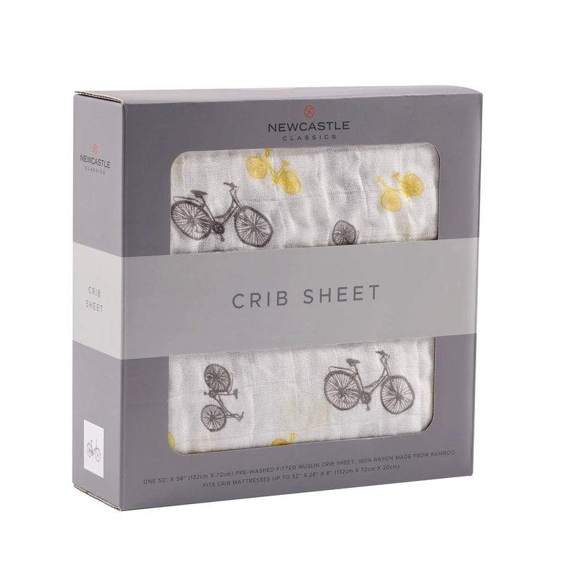 Vintage Bicycle Bamboo Muslin Crib Sheet in packaging with bicycle pattern, soft and breathable.