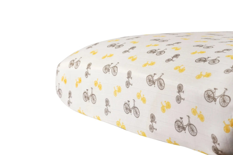 Vintage Bicycle Bamboo Muslin Crib Sheet with brown and yellow bicycle pattern.