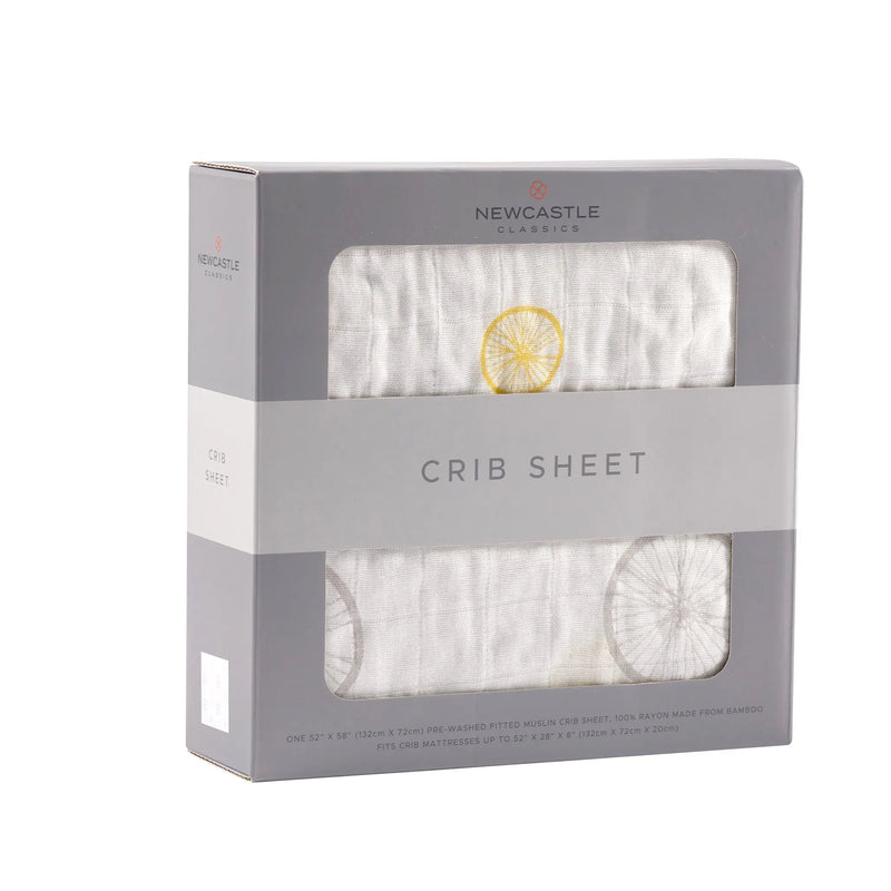 Vintage Wheel Bamboo Muslin Crib Sheet in packaging.