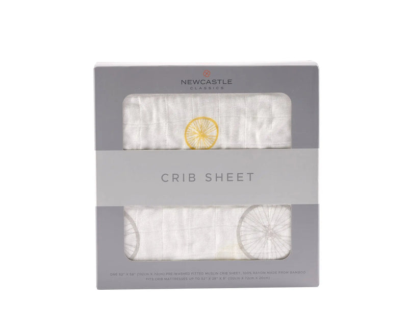 Vintage Wheel Bamboo Muslin Crib Sheet in packaging, soft and breathable.