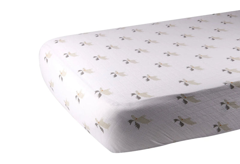 Mister Moose Cotton Muslin crib sheet on standard mattress, soft breathable fabric with moose pattern.