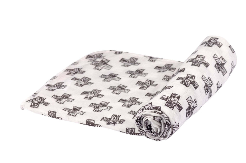 Nordic Stamp Bamboo Muslin Swaddle with black pattern, rolled and partially unrolled.