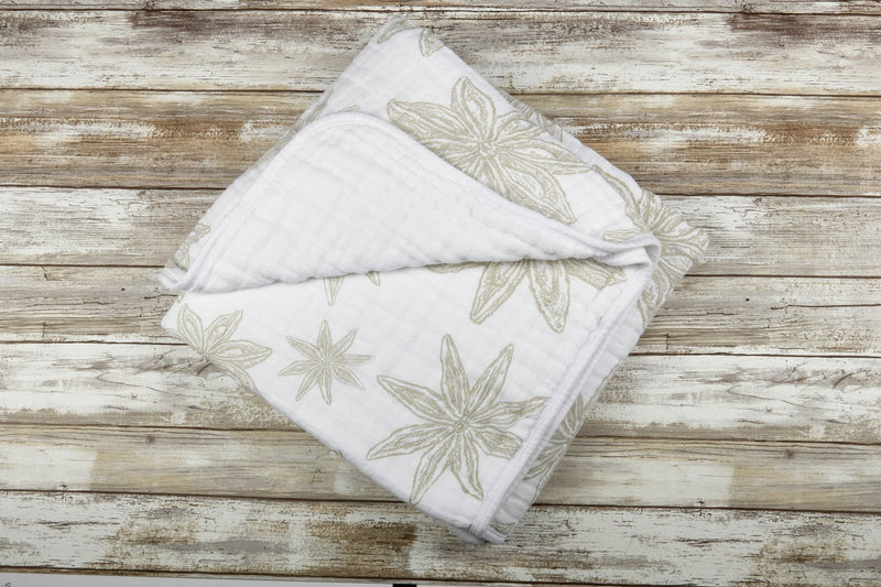 Boho Fields Cotton Muslin Newcastle Blanket with floral design, soft and breathable.