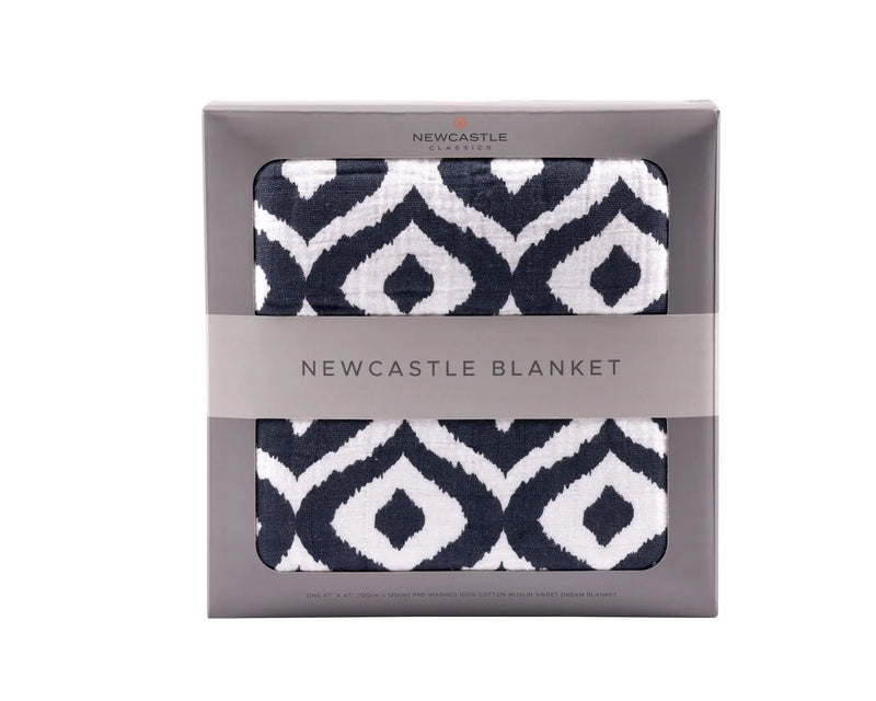 Moroccan Blue Cotton Muslin Newcastle Blanket in packaging with geometric design.
