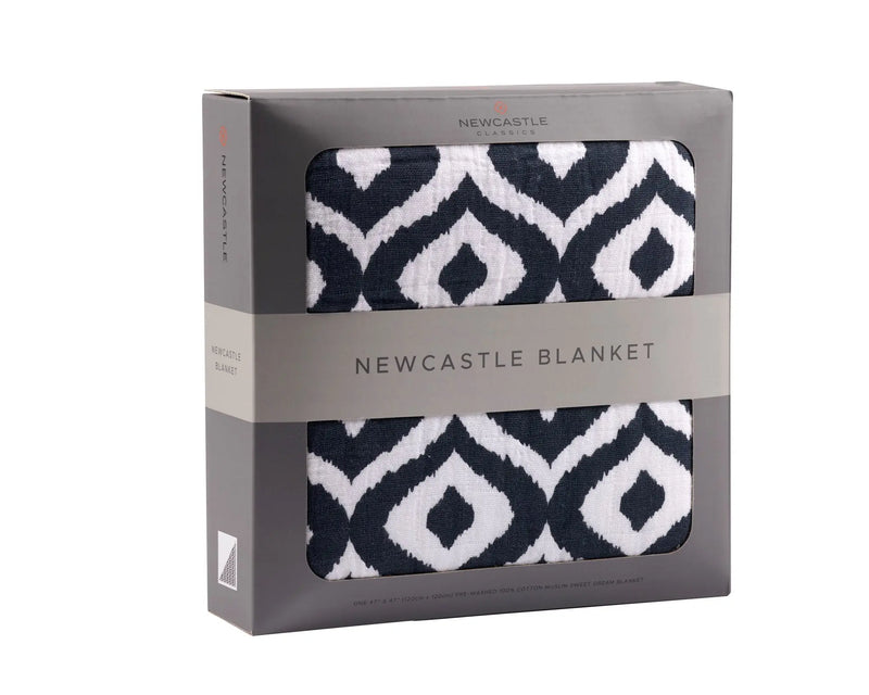 Moroccan Blue Cotton Muslin Newcastle Blanket in packaging with geometric pattern design.