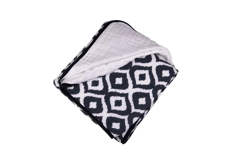 Moroccan Blue Cotton Muslin Newcastle Blanket with geometric pattern, soft and breathable four-layer natural cotton.