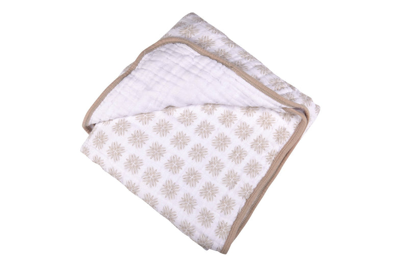 Flower Child Cotton Muslin Newcastle Blanket with floral pattern.