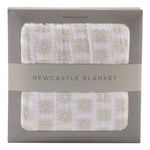 Cotton muslin blanket in a Flower Child floral print, folded to show its soft layered fabric