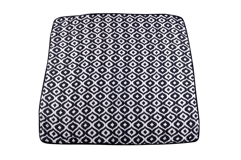 Morrocan Blue and Flower Child cotton muslin blanket with black and white geometric pattern.