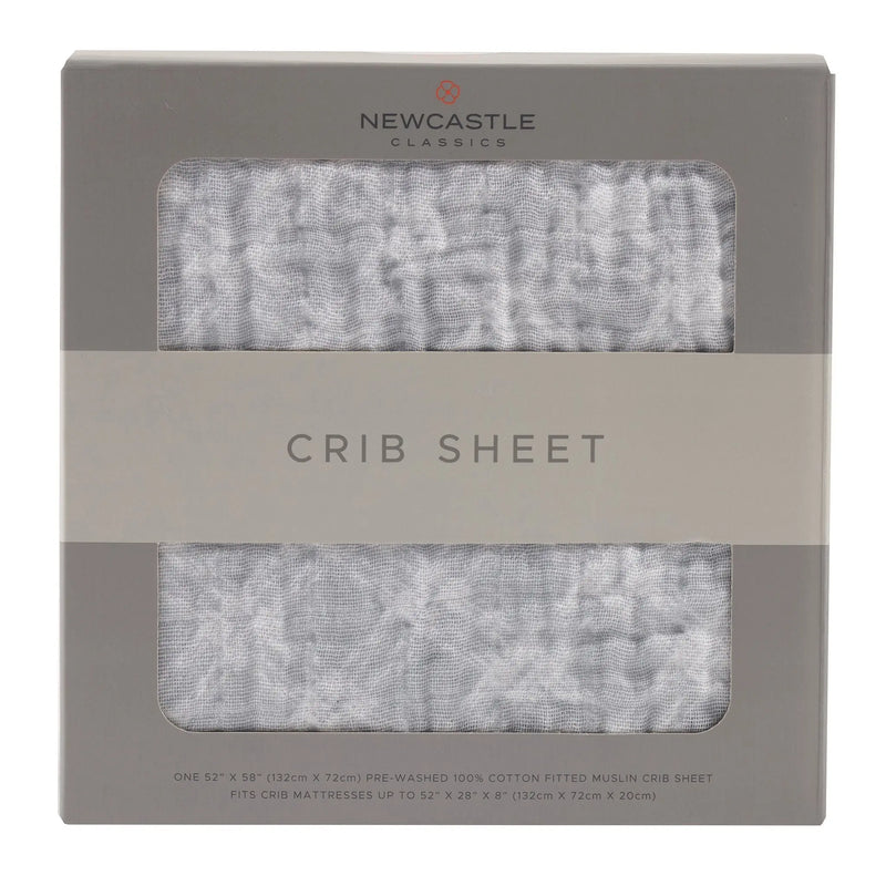 Glacier Grey Plaid Cotton Muslin Crib Sheet in packaging.