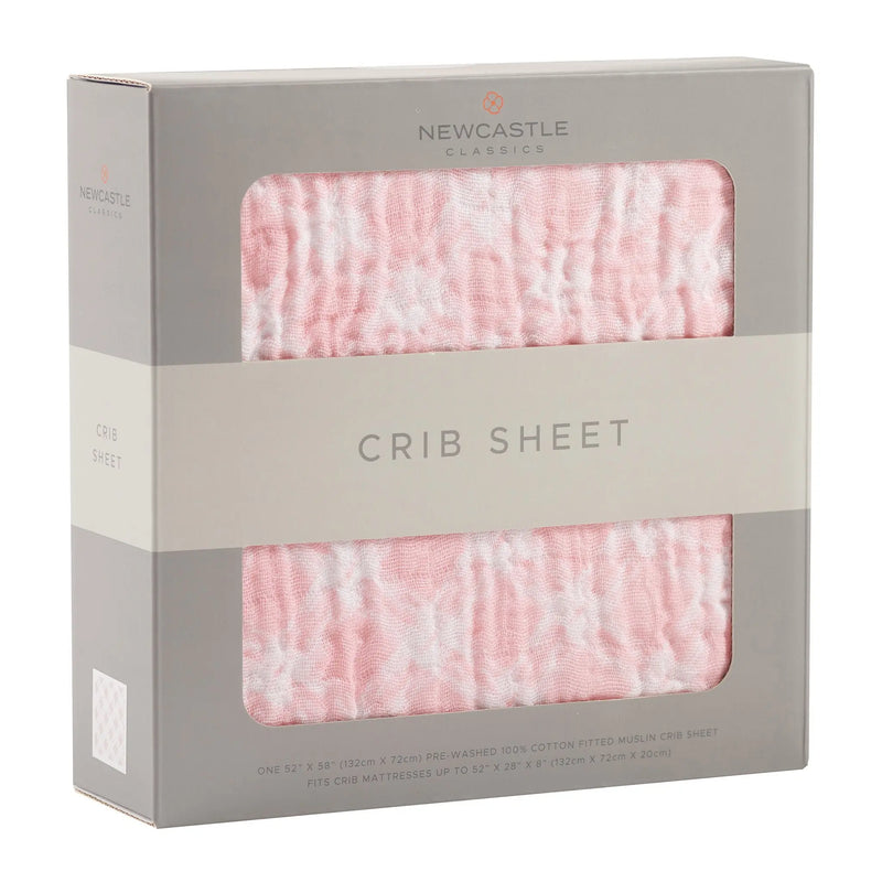 Primrose Pink Plaid Cotton Muslin Crib Sheet in packaging, soft and breathable.