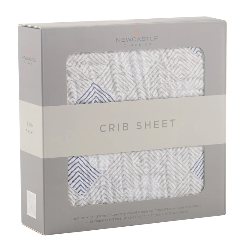 Mountain Peak Cotton Muslin Crib Sheet in packaging, breathable and soft.