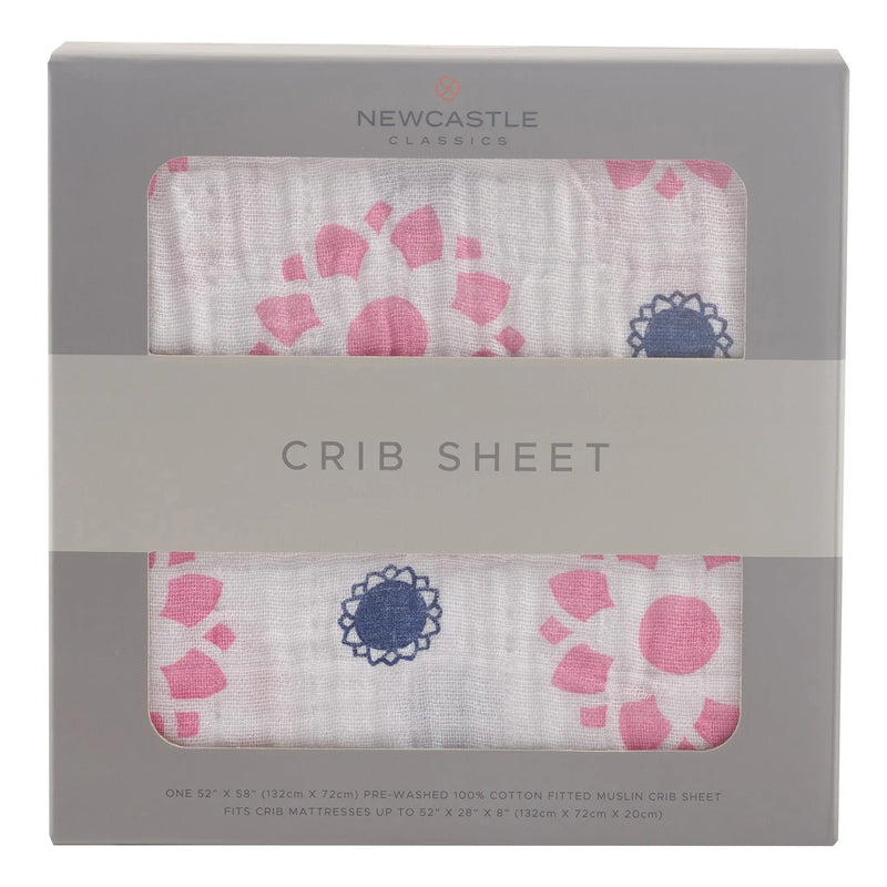 Primrose Indigo Cotton Muslin Crib Sheet in packaging, breathable and soft.
