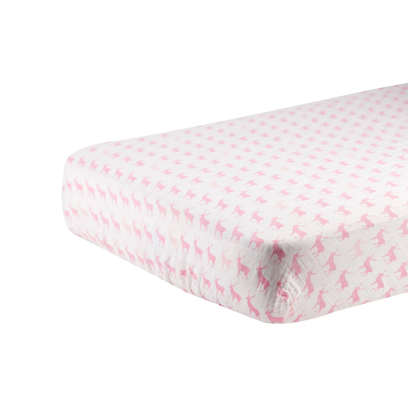 Pink Deer Cotton Muslin Crib Sheet on a standard crib mattress.