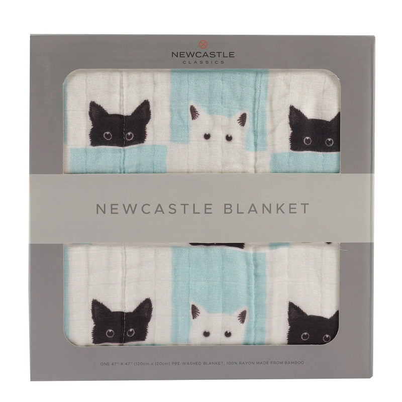 Peek-A-Boo Cats and White Bamboo Muslin Newcastle Blanket in packaging.
