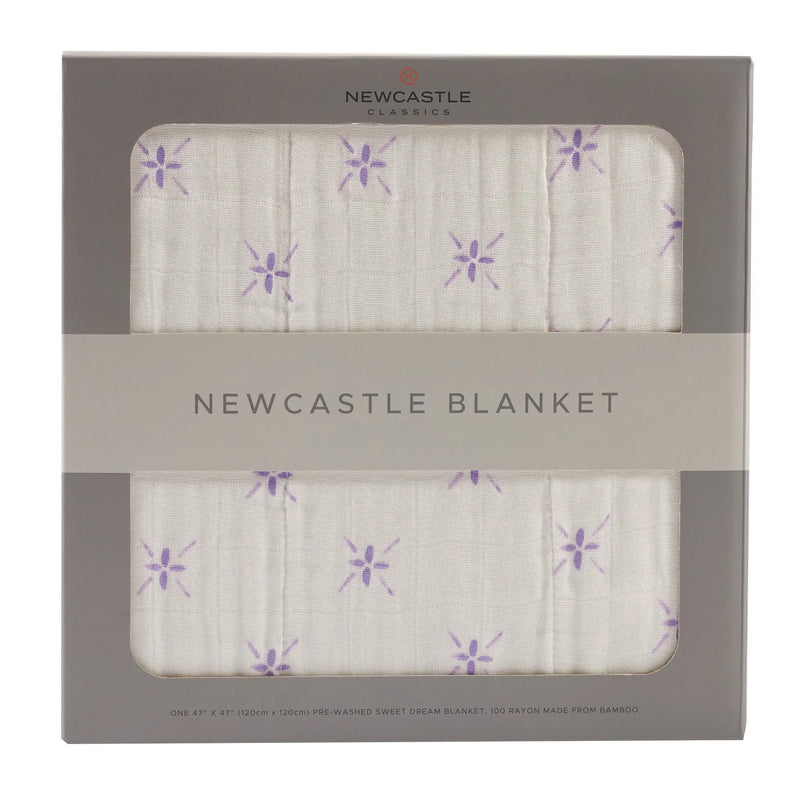 Lavender flower and white bamboo muslin blanket in packaging.