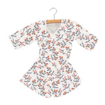 Child's mini robe in dahlia floral print with wrap ties and front closure