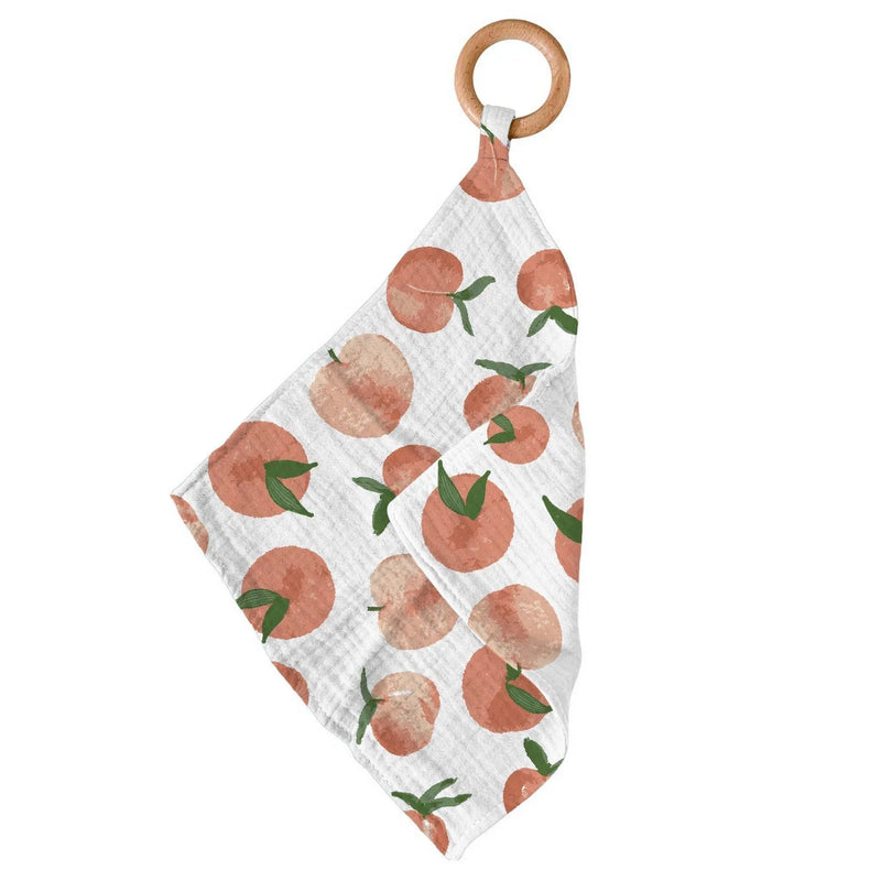 Carnelian Peaches Newcastle Teether with bamboo blankie and wooden ring.