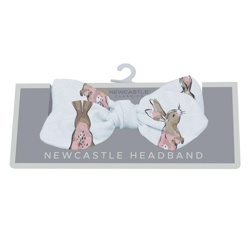 Powder pink bunnies bamboo headband from the Wildflowers Collection, one size.