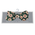 Baby headband in a warm floral print with sunset-toned flowers on a soft band