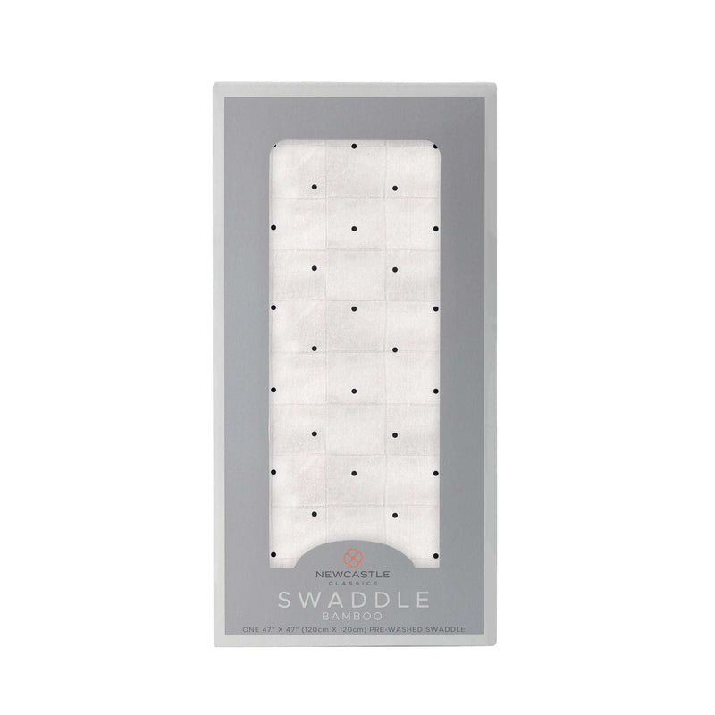 Black and white polka dot bamboo swaddle in packaging.