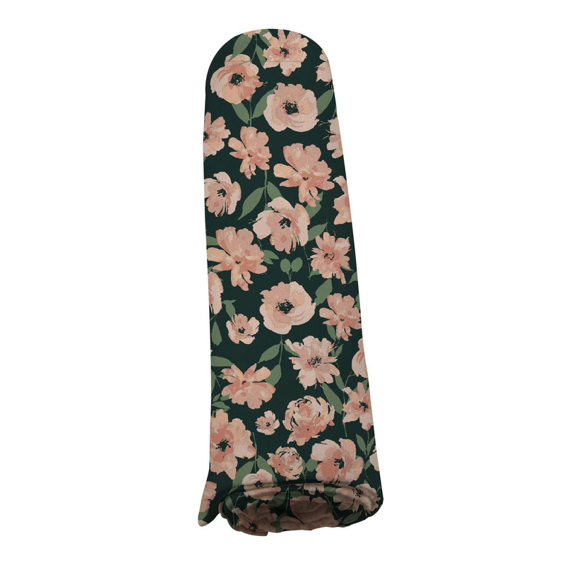 Canyon Sunset Flowers bamboo swaddle with pink floral design on dark background.