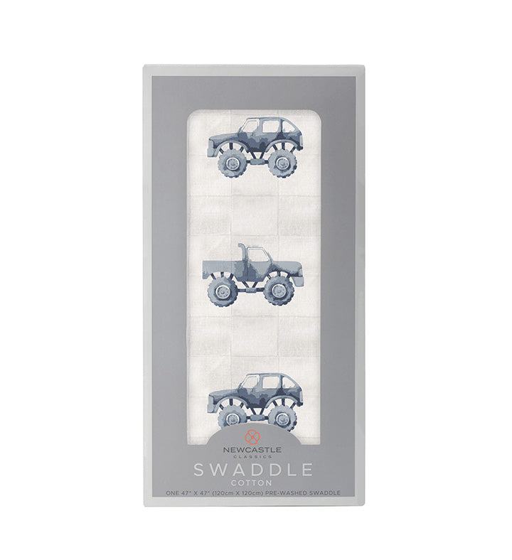 Indigo Monster Trucks Cotton Swaddle in packaging featuring truck design.
