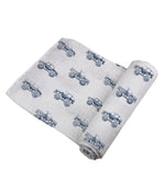 Soft indigo monster trucks cotton swaddle by Newcastle Classics.