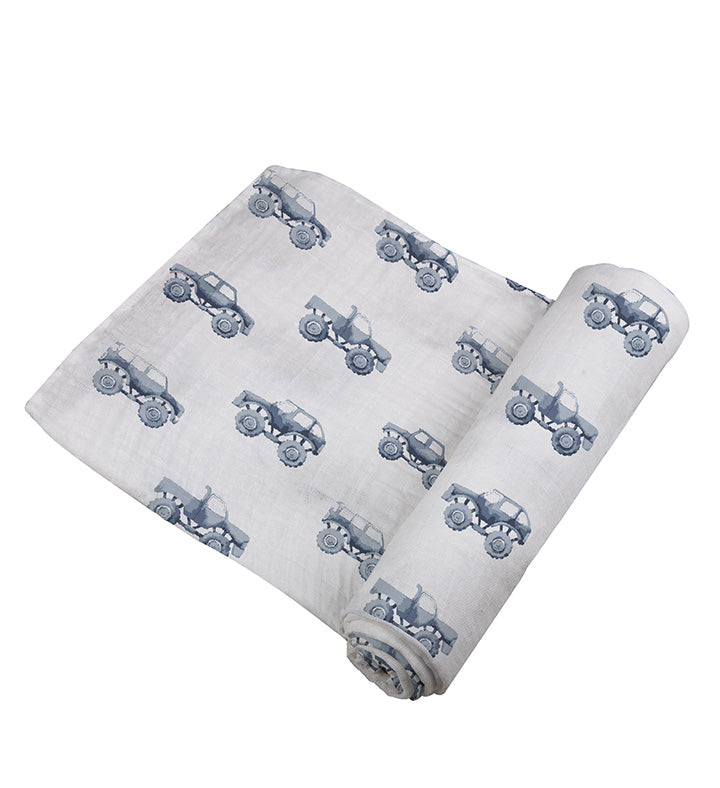 Soft indigo monster trucks cotton swaddle by Newcastle Classics.