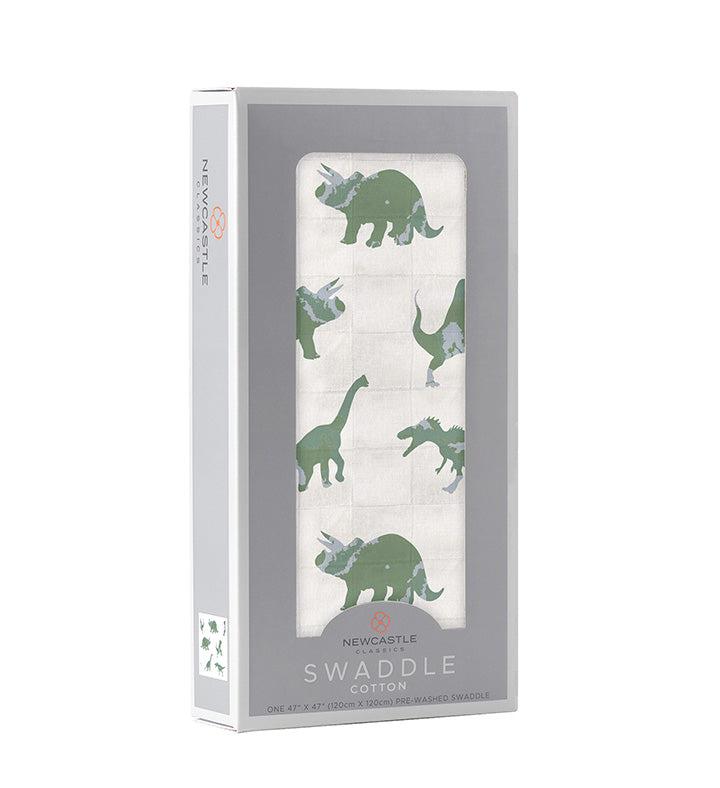 Granite green dinosaur print cotton swaddle in packaging.