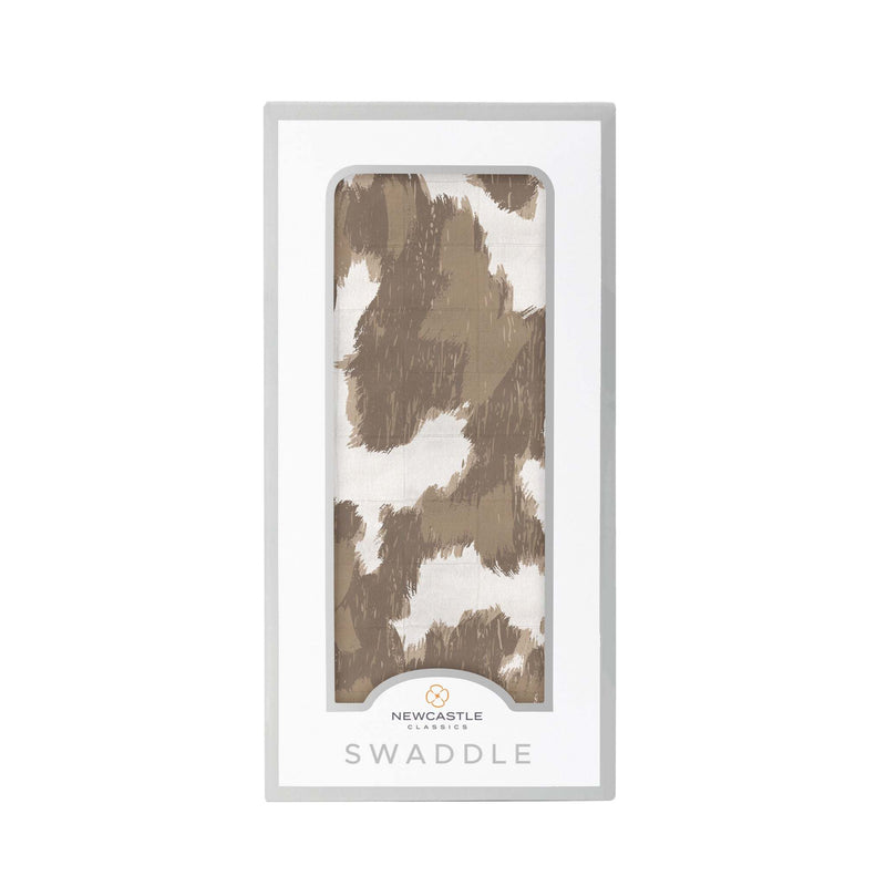 Yellowstone Cowhide Bamboo swaddle in packaging, soft breathable muslin.