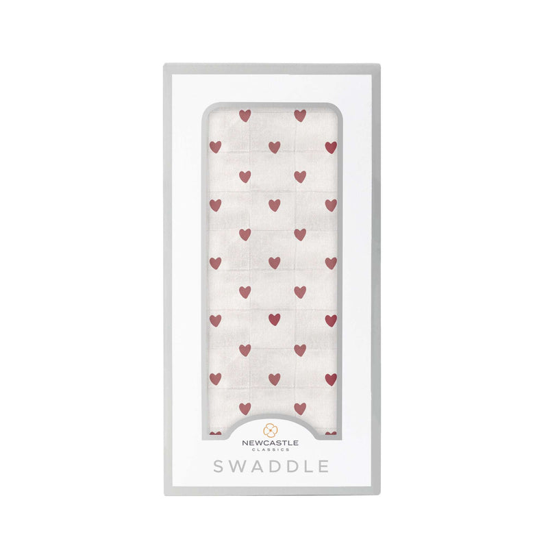 Two Hearts Bamboo Swaddle in packaging with heart pattern, made from natural bamboo muslin, size 47" x 47".